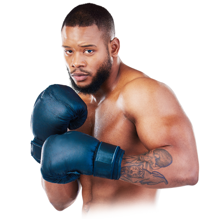 Male boxer in blue gloves, fists up in a fighting stance with a focused expression.