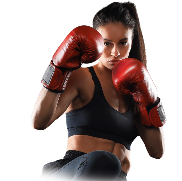 Female boxer in a black sports top with red gloves in a ready-to-punch stance, focused on her opponent.